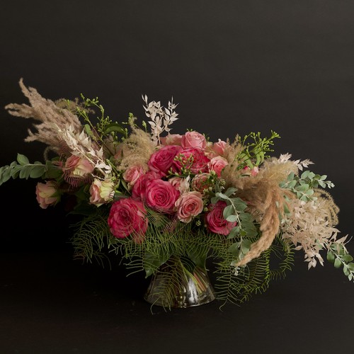 Pink roses with pampas grass and eucalyptus on dark background from Raleigh NC florist