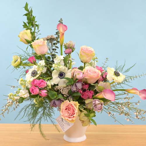 Pastel anemones and calla lilies with garden roses in white vase from Raleigh NC florist